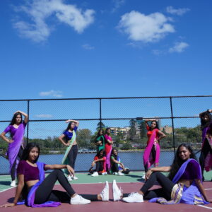 Teens Crew - Group of teenager dancers posing in colourful clothing in a tennis court